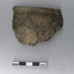 Rim of a Bronze Age cooking pot with cord impressed decoration, found at Godrevy Warren